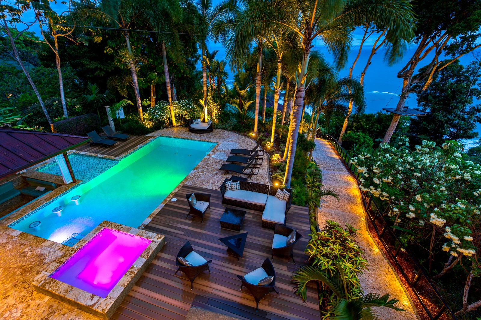 The VIVARA pool deck lit up at night — the kind of stay advisors earn commission on
